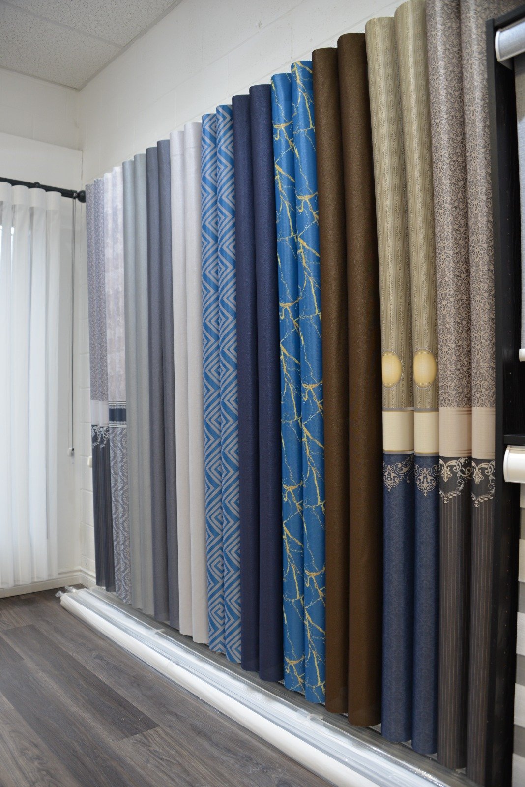 Owner installing custom blinds — behind the scenes
